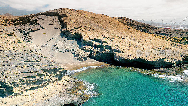 Aerial view of the hidden cove beach "La Rajita" at the natural reserve of "Monta?a Pelada" in Tenerife (Canary Islands). Drone shot